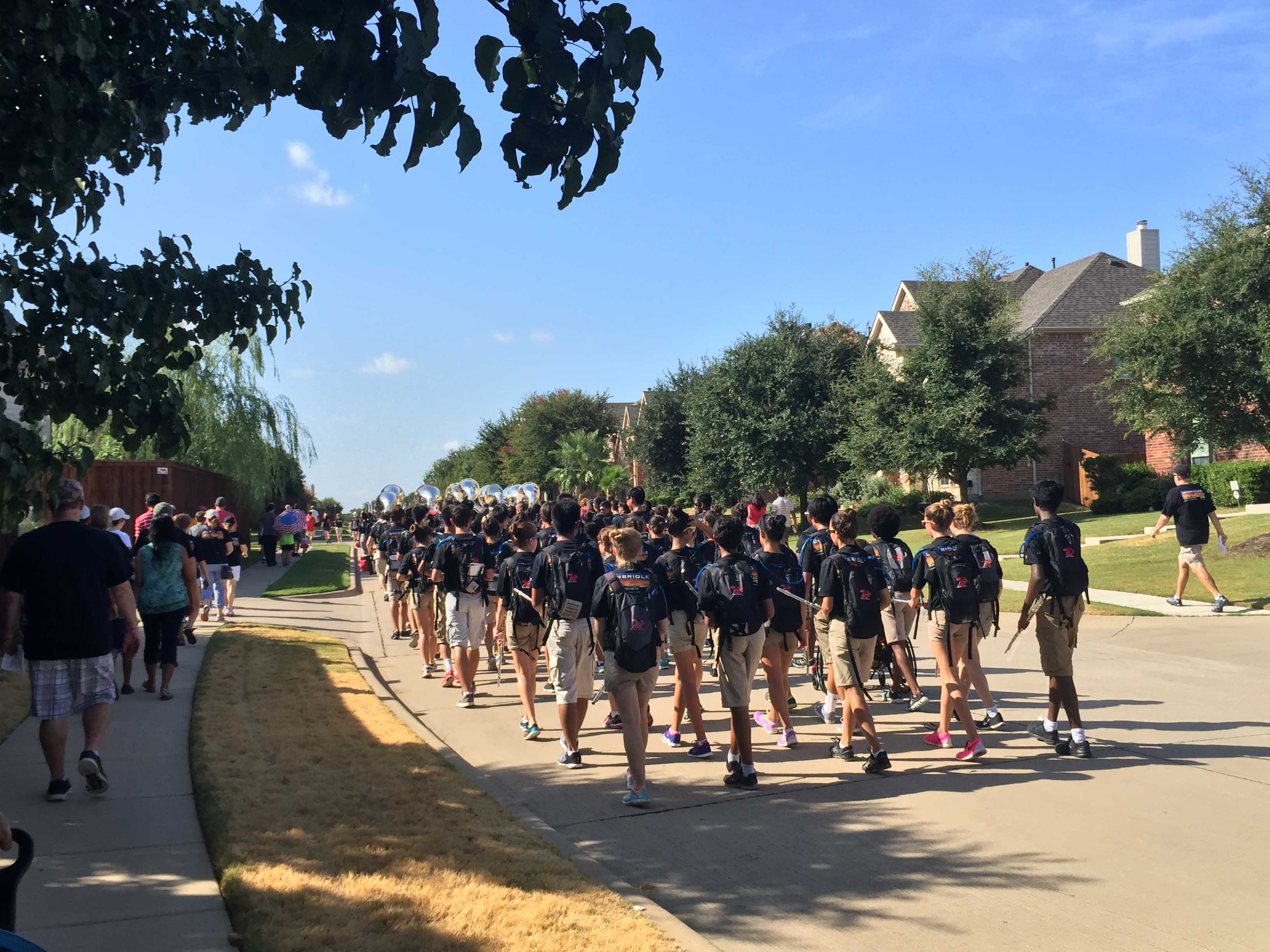 With supports walking along on the sidewalk, the band makes its way through the Turnbridge Manor and Hunters Creek neighborhoods as part of Saturday's March-a-thon.