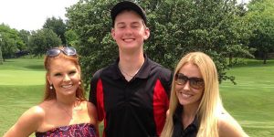 Flanked by Brandi Redmond (L) and Stephanie Hollman (R), stars of the hit TV show, The Real Housewives of Dallas, senior Alex Moore enjoyed a chance encounter with the two women at the Byron Nelson golf tournament. 