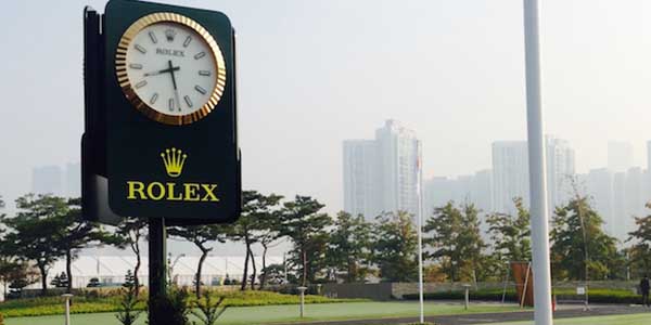 With the skyline of Incheon, South Korea in the background a Rolex clock shows the time at the Jack Nicklaus Golf Club Korea.