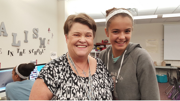 Yearbook adviser Carole Babineaux poses with freshmen Andrea Chladny in the yearbook room. The staff has been working on the book since summer and has a theme and a cover picked out.