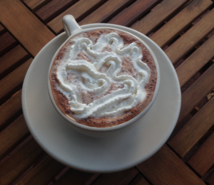 The hot chocolate at the coffeehouse does not disappoint with a rich, velvety flavor.