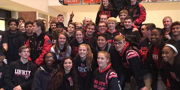 in addition to competing in the Rockwall Heath tournament over Thanksgiving break, the wrestling team attended the Oklahoma State wrestling match against Minnesota on Sunday when they posed for this picture.