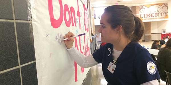 “The only way we will be able to develop ourselves as humankind is by recognizing each other’s differences and making sure it’s all okay,” Best Buddies president Rylee McHenry said. Signing a poster in the cafeteria that urges people to not dismiss the abilities of others, McHenry is a leading proponent of the schools White Ribbon Week. 
