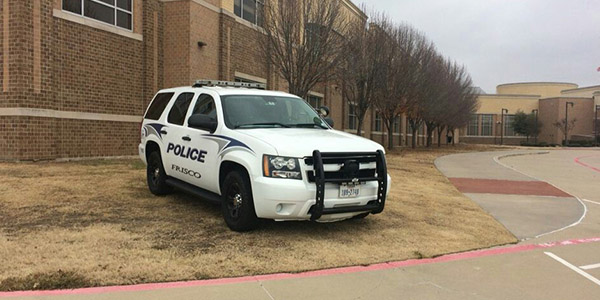 The Frisco PD car of school resource officer Jerry Varner sits parked in front of the school. According to Varner the Open Carry law recently enacted in Texas will likely make little difference in everyday life. 