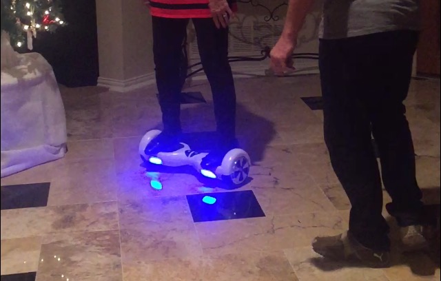 Senior Halle Barhams grandmother attempts to master the Hoverboard360 the family found under their tree Christmas morning.