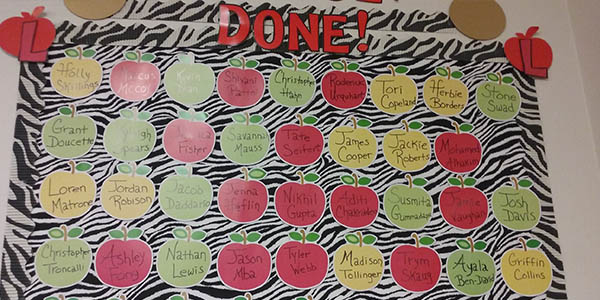 Students selected as the Student of the Month get their name on an apple on a bulletin board in Michelle Porters English room. 