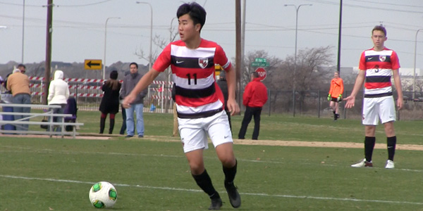 Sitting in fifth place heading into the second round of district play, the boys have some ground to make up in the standings. Pictured above, senior David Kwon looks to make a pass in a game earlier this year. 