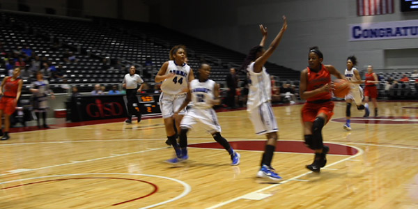 Leading the way on the break, freshman Randi Thompson drives to basket for the layup. 