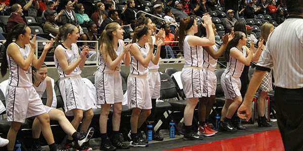 The bench cheers their teammates on near the end of the girls win over previously unbeaten Mansfield Timberview.