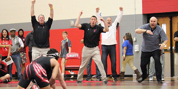 he coaches celebrating a huge win by Freshman Tristan Tadeo in Triple Overtime of the Consolation Semi-finals.  Tristan qualified for State with the win.
