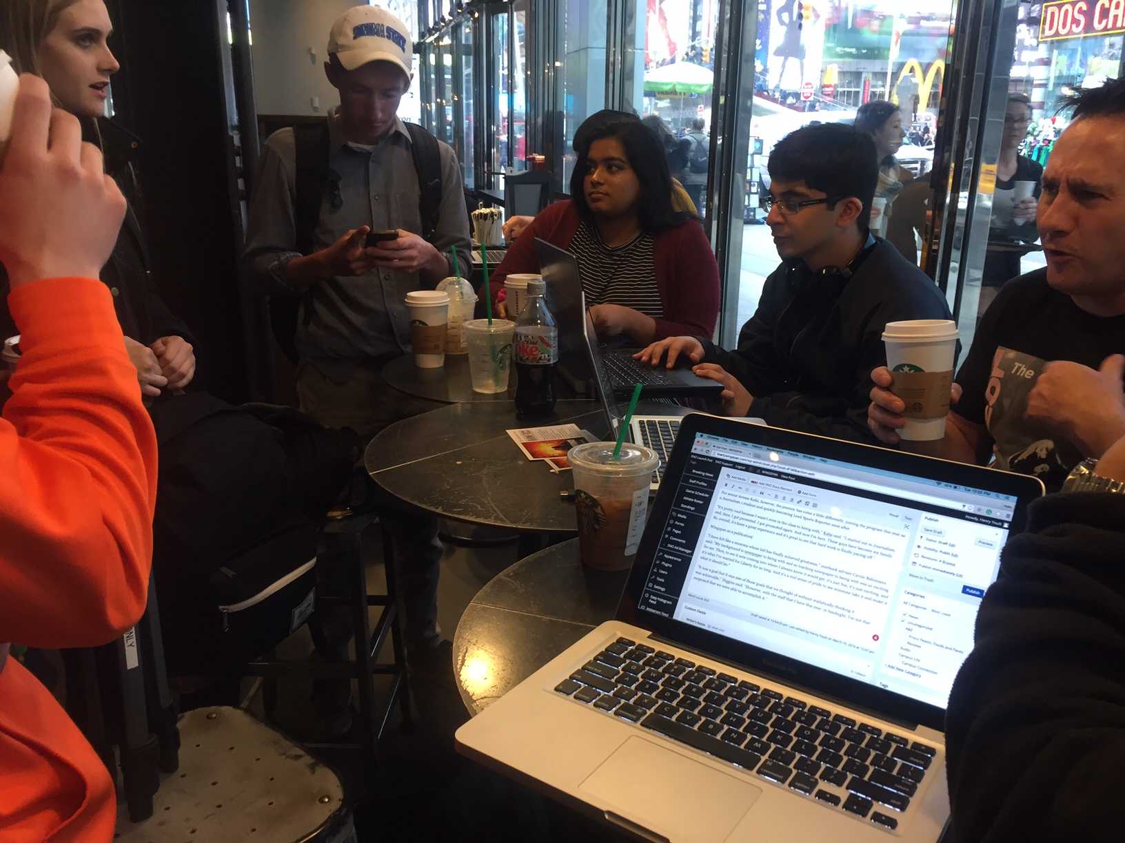 Students settled down in the Times Square Starbucks to work on content to post for the remainder of the week.