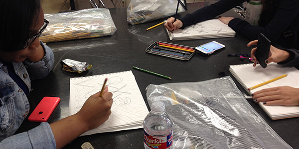 Sophomore Lakenya Alexander sketches out her work in her art class. 