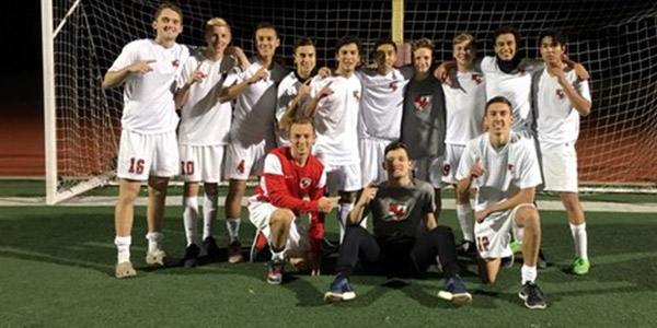 Seniors from the boys varsity soccer team pose together after their 4-0 win against the Colony High School.