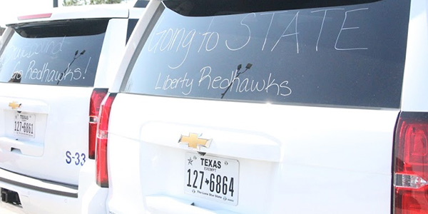 The back of the FISD SUVs make it clear where the girls basketball team was headed.