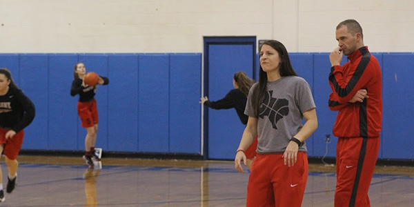 Assistant basketball coach Leslie Powell and head basketball coach Ross Reedy look on during Wednesdays shootaround. 
