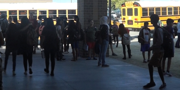 When the bell rings to end the school day at 4:10 p.m., there is a rush to leave campus. For those that cant drive, its to the back of the school where the buses wait. 