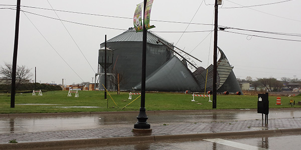 One of the metal grain silos near the corner of John Elliott Drive and Main Street collapsed because of high winds in the March 8 morning storms. 