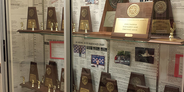 Campus UIL director Jeff Schrantz hopes to add another trophy to this display case with a strong performance at the UIL Academic State Meet April 21-22 at UT Austin. 