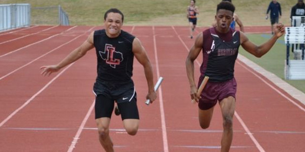 Isaiah Palmer (left) placed second in the 400 meter run at the state meet.