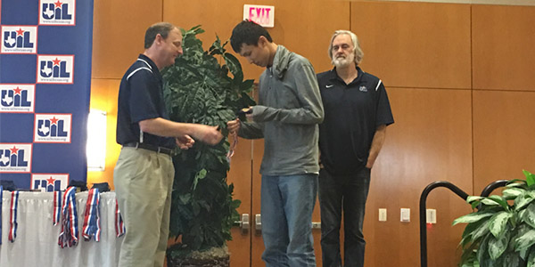 Sophomore Bill Wang accepts his fifth place individual award in science at the state meet in Austin. 