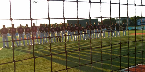Lining up along the first baseline, the baseball team stands for the national anthem before Fridays opening round playoff game against Prosper at Plano West. The team would go on to lose the game 10-1 and the series 2-0. 