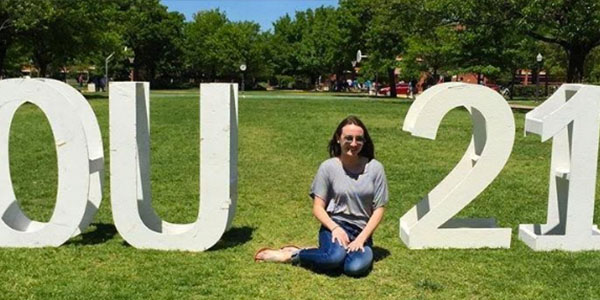 Posing between the OU letters and her expected graduation year, junior Mallory Reed made her college visit to Norman, OK. 