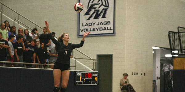 Senior floor captain Delanie Lewis serves up to put the team on the board.