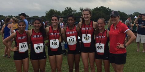 The girls varsity team after its third place win at the Lovejoy XC Fall Festival.