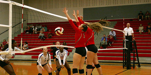 Kate Blasingame and Delanie Lewis put the ball down with a block.