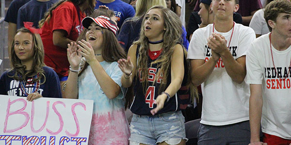 Seniors (left to right) Mikayla Rankert, Tori Copeland, Shae Evans, Andrew Moore and Logan Ransom cheer on the team.