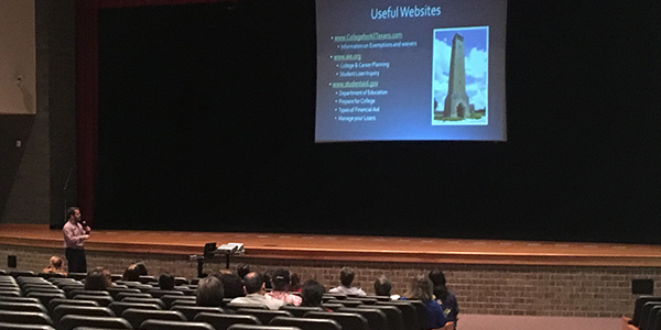 Parents listen and look at Thursdays financial aid workshop in the auditorium. The informational session provided a glimpse at how to apply for financial aid and whats available. 