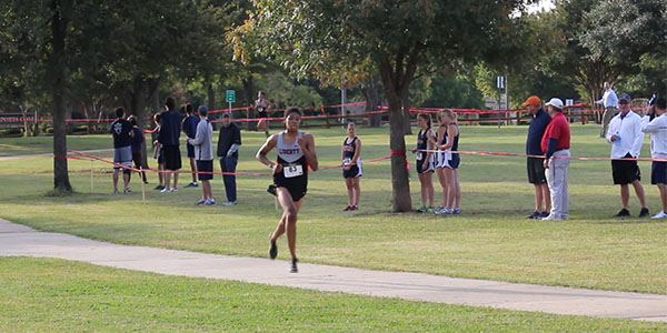 Senior Nicholas Wynne running to the finish to place 4th, with senior Josh Akin just behind taking 5th.
