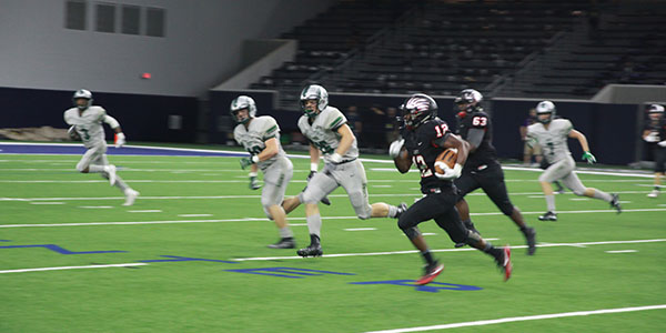 Trying to outrace the defense, junior Jordan Jones tries to get outside in Thursdays 50-35 win over Reedy at the Ford Center. 
