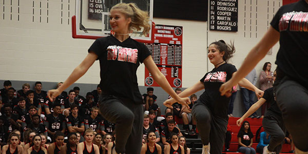 Dancing in the gym, Red Rhythm performs during the senior pep rally. 