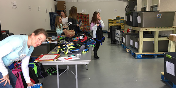 Groups and organizations from throughout the area will work in the storage facility to pack the food bags delivered to students in the district. 