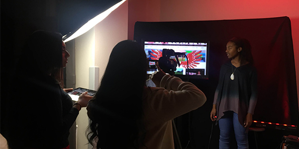 WTV staff member Divya Murali (left) and WTV Daily Update Producer Neha Perumalla (right) get the camera and monitor images ready as anchor Kennedy Williams prepares to host a WTV Daily Update which is once again being shown in 2nd period every day. 