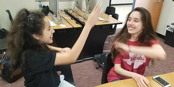 Being happy can have an impact on day to day life and the Happiness Challenge hopes make happiness a habit.
I am very energetic when I am positive, sophomore Jennifer Hernandez said after high-fiving classmate and fellow sophomore Ariela Rodrigues. 