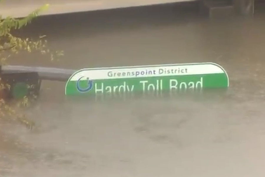 Hardy Toll Road, typically busy, is now deserted as water levels rise to the street lights.