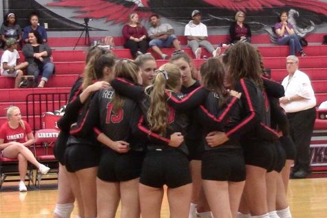 Facing off against Lewisville on Aug. 22, 2017, the volleyball team huddles during a quick break during the action. The Redhawks are back in action Tuesday when they take on Lewisville at home. 