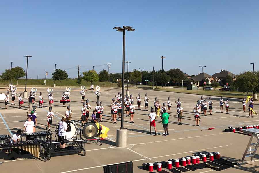 Practicing on the south student parking lot, the marching band is seen most frequently at football games, but this this year the band has another goal in mind.

“In this past year specifically I’ve seen a shift from the band being oriented towards a goal to more towards the process by which we achieve said goal,” senior drum major Shane Bugni said. “Specifically this state year the goal is clearly to make state marching contest.