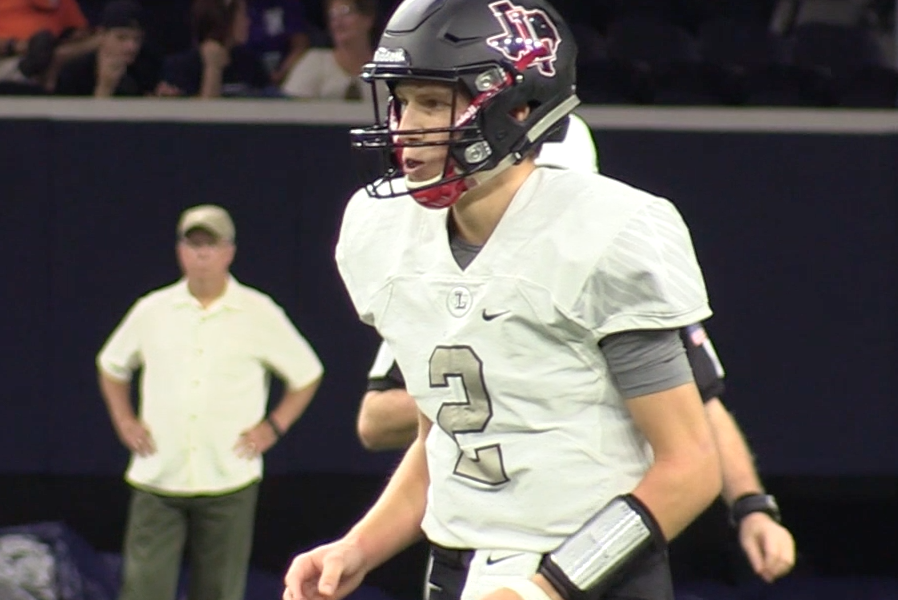 Taking on the first place team in District 13-5A Friday at the Ford Center, senior quarterback Carson Morris gets ready to take a snap as the team faced off against Lone Star. Falling behind 21-0 at the end of the first quarter, the Redhawks eventually lost 52-0 on Oct. 13, 2017.

Carson Morris 