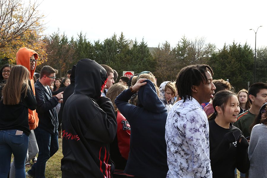 Students and staff were evacuated when a fire alarm sounded at approximately 2 p.m. on Thursday. Standing outside in temperatures in the low 40s, people did what they could to stay warm. The alarm sounded as a result of a water piper breaking in the auditorium. 