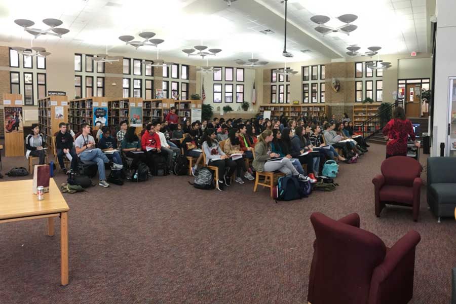 Humanities classes look on as author Gareth Hinds Skypes in as part of a lesson analyzing Hinds art and his interpretation of the classic novel Beowulf. 