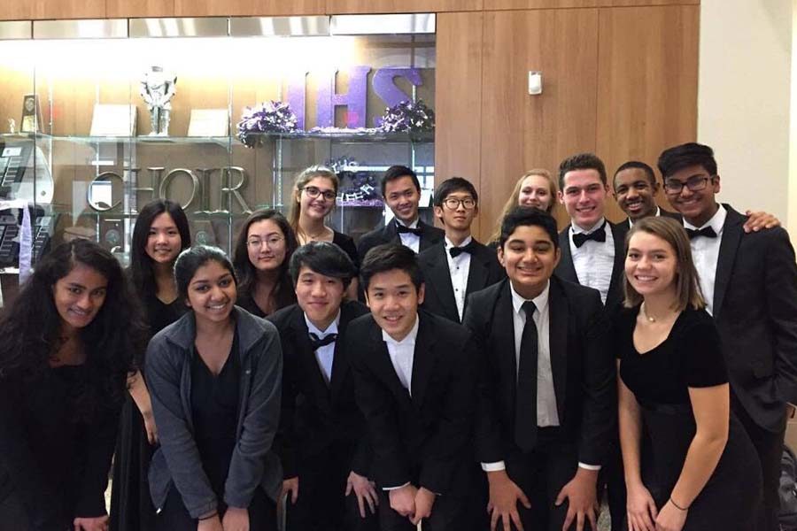 Band and orchestra students admitted into the 2017 All-Region orchestras pose after performing in the concert.