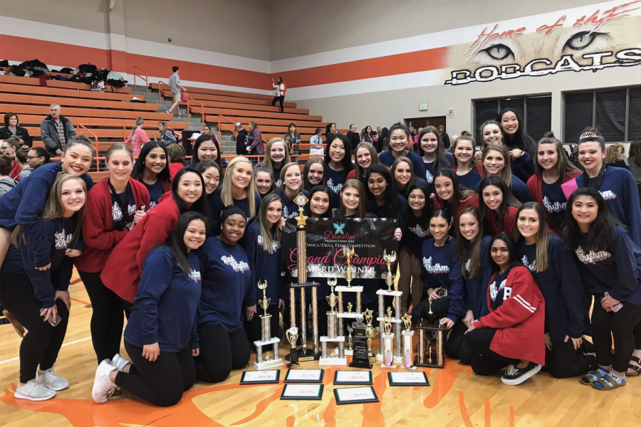 Red Rhythm shows off the multiple awards the team won at the Danceline Productions USA Dance/Drill Team Competition at Celina High School. 