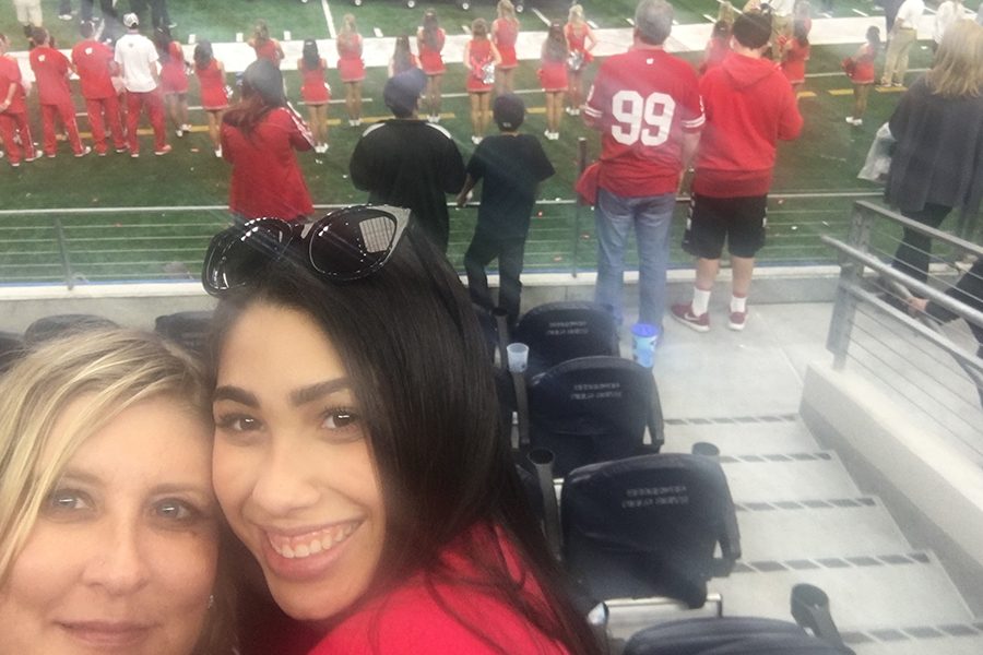 Kierra Lewis poses with mother, Heidi Stevens, at a Wisconsin football game.