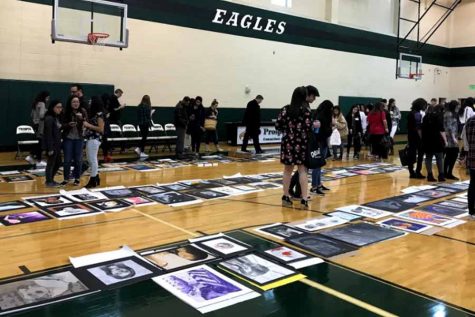 Students from throughout the area look at artwork on display in one of the gyms at Prosper High School for Saturday's VASE competition. A total of 40 students on campus were rated with the highest score of four, meaning “superior,” and three of them advanced to the state level; including sophomores Christine Le and Zoe Meeker. 