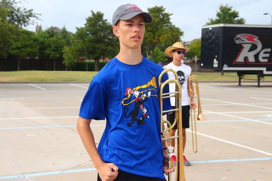 Junior Jack Buss at a practice with his trombone. 