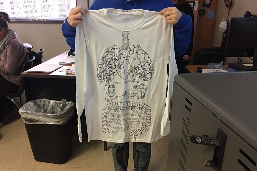 Showcasing some of the bodys internal organs, Medical Terminology student Amber Holt displays her interactive t-shirt. 