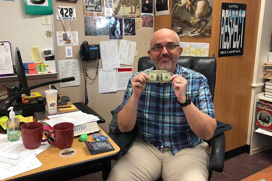 When teachers like AP World History teacher Jeff Crowe are called in to fill in due to a shortage of substitute teachers, they will now get paid $21.50 more than what he is holding in his hand. 